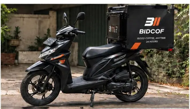 Konsep motor BIDCOF Coffee on the Road dengan box kopi custom berwarna hitam dan oranye